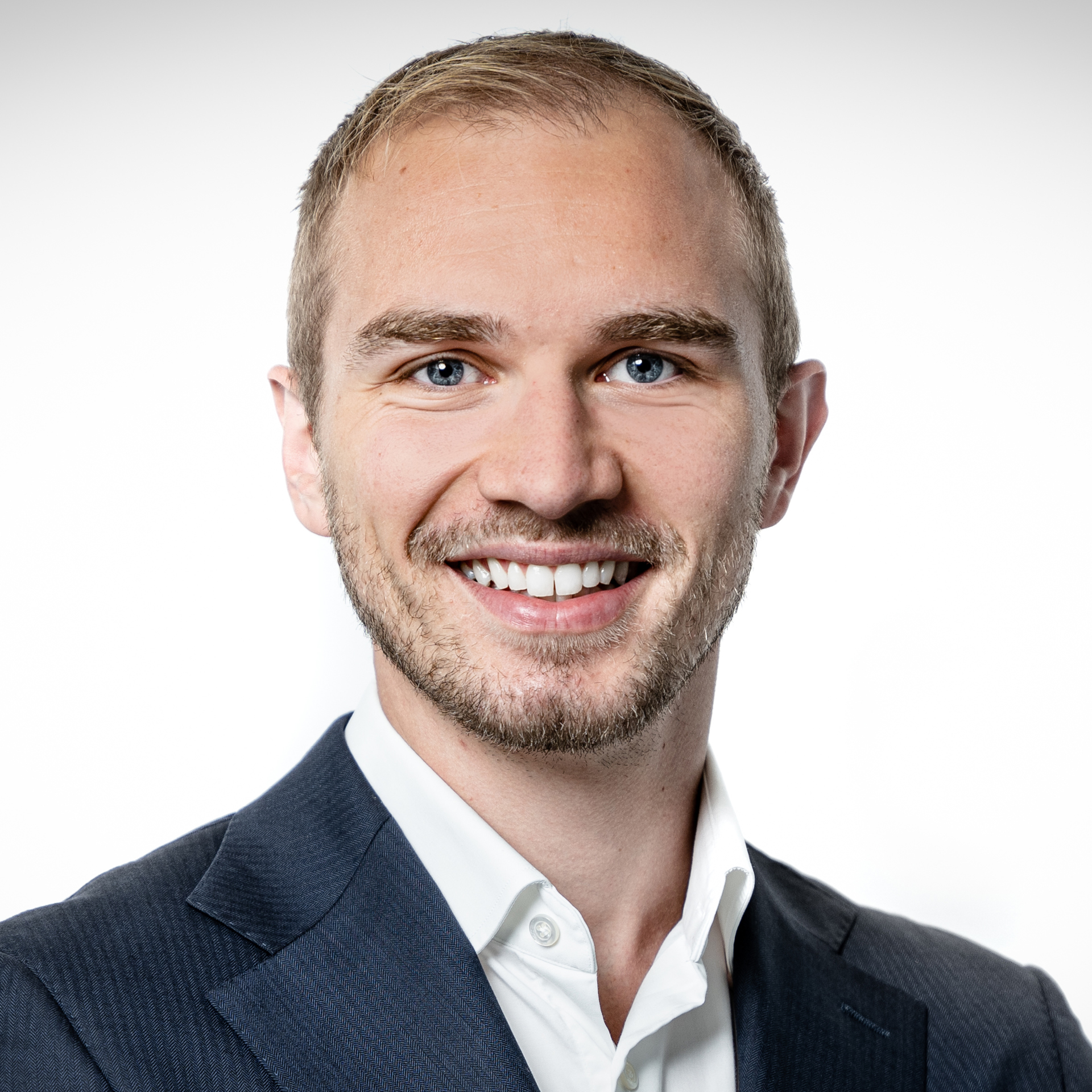 a man smiling at the camera