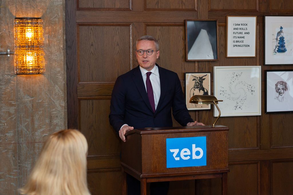 a man standing at a podium