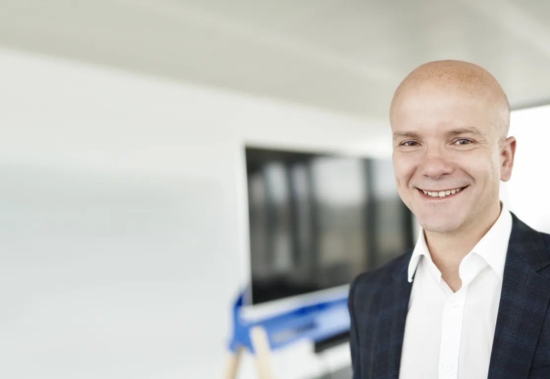 a man smiling at camera