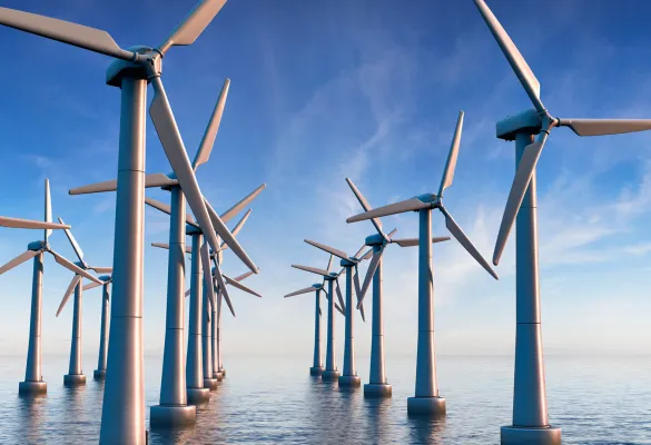 a group of windmills in water a group of windmills in water