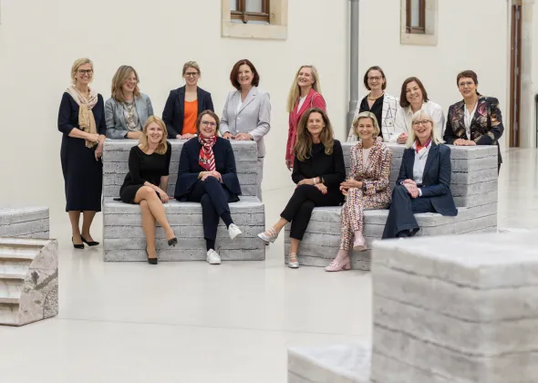a group of women posing for a photo