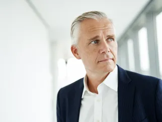 a man in a suit looking away