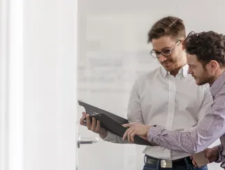 a man looking at a clipboard