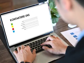 a person typing on a laptop a person typing on a laptop
