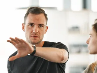 a man holding his hand up