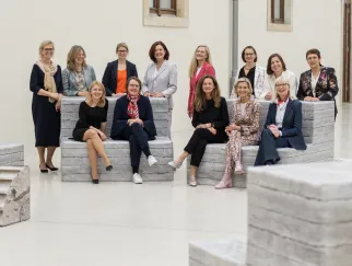 a group of women posing for a photo