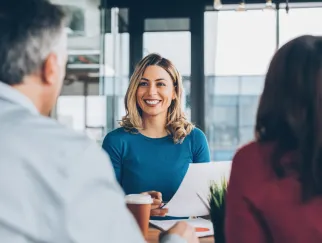 a woman smiling at a man a woman smiling at a man