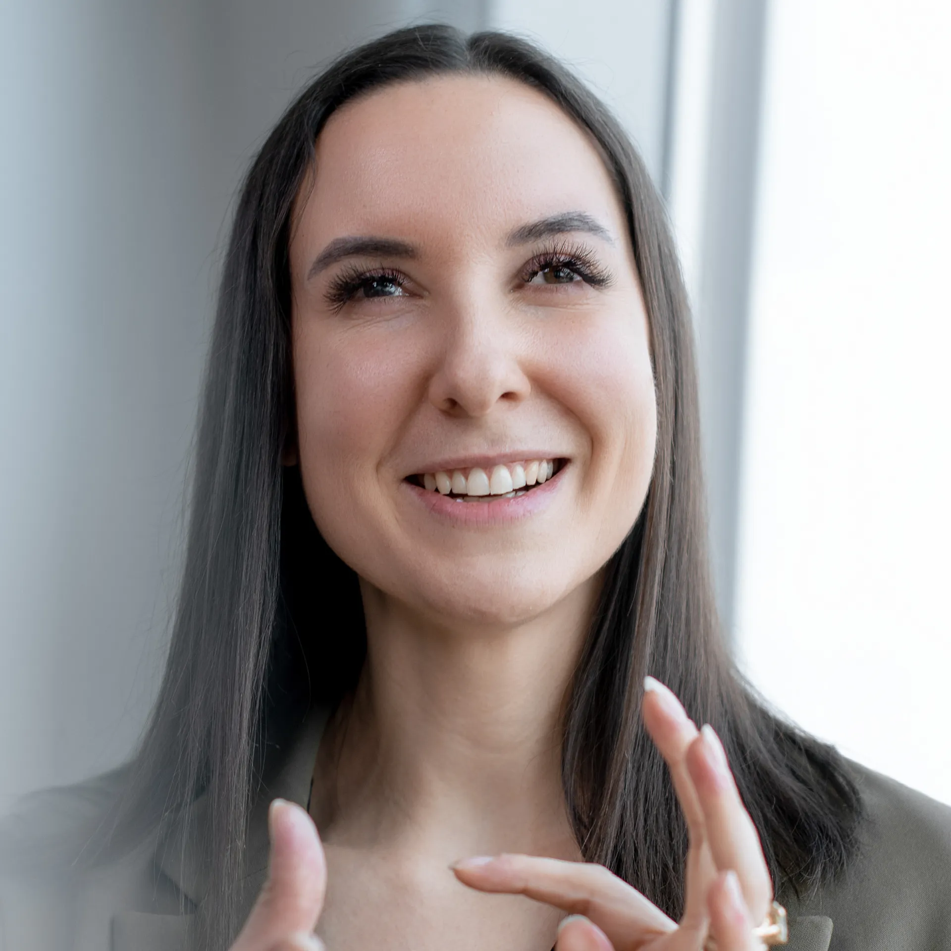 a woman with long hair smiling