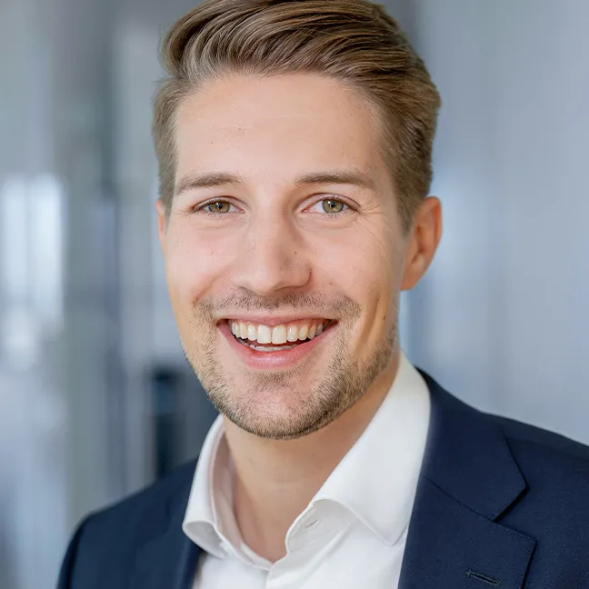 a man smiling at the camera