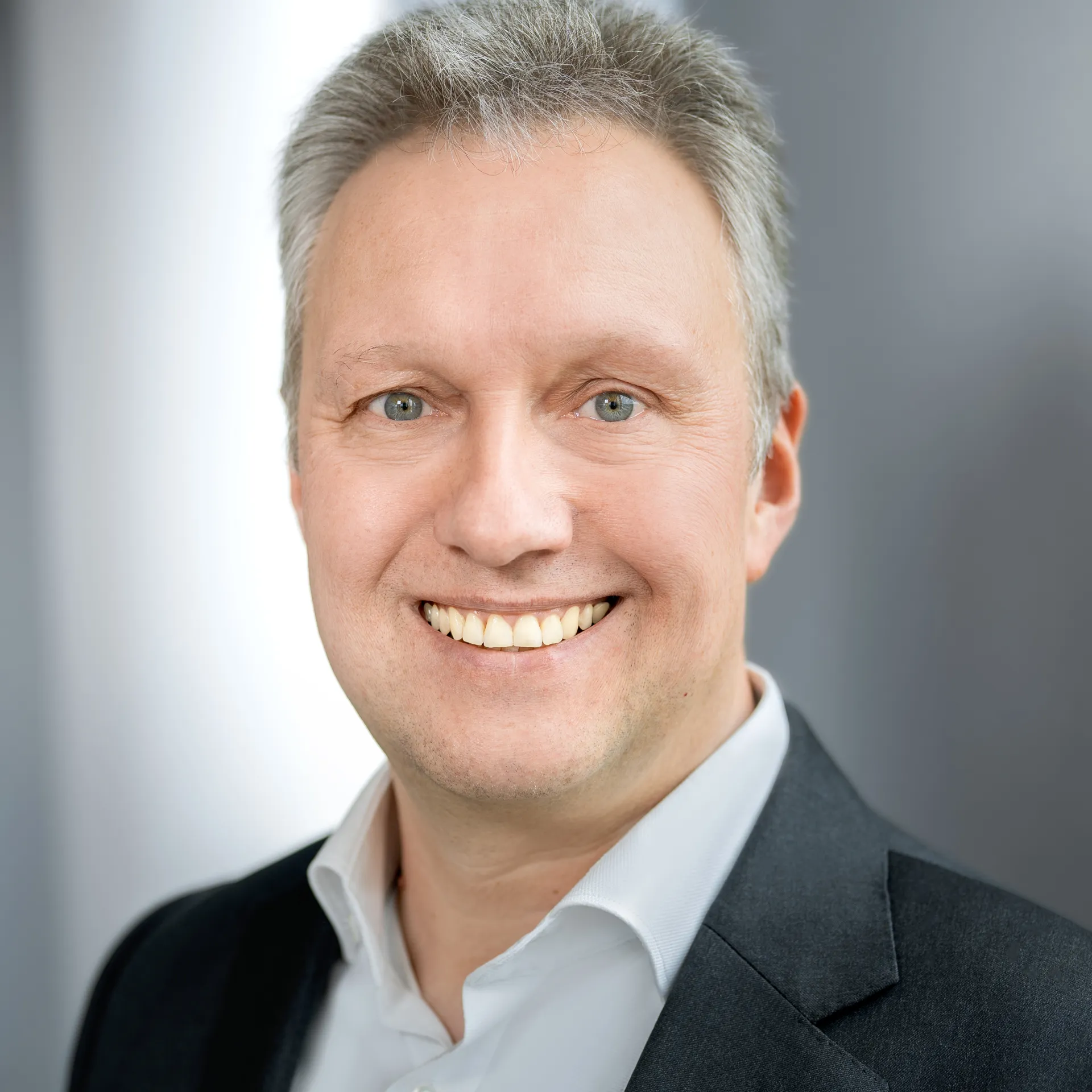 a man smiling for a picture