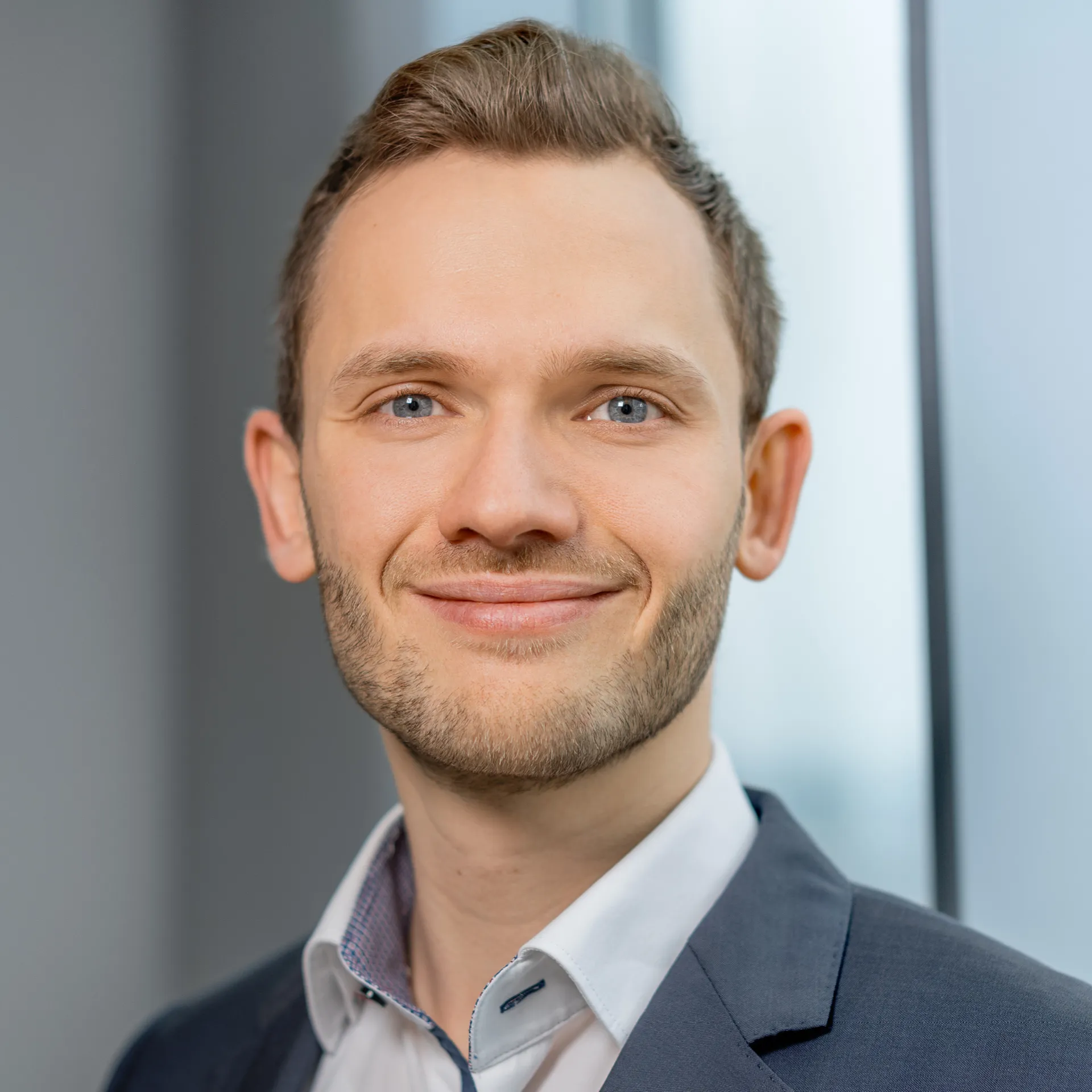 a man smiling at the camera