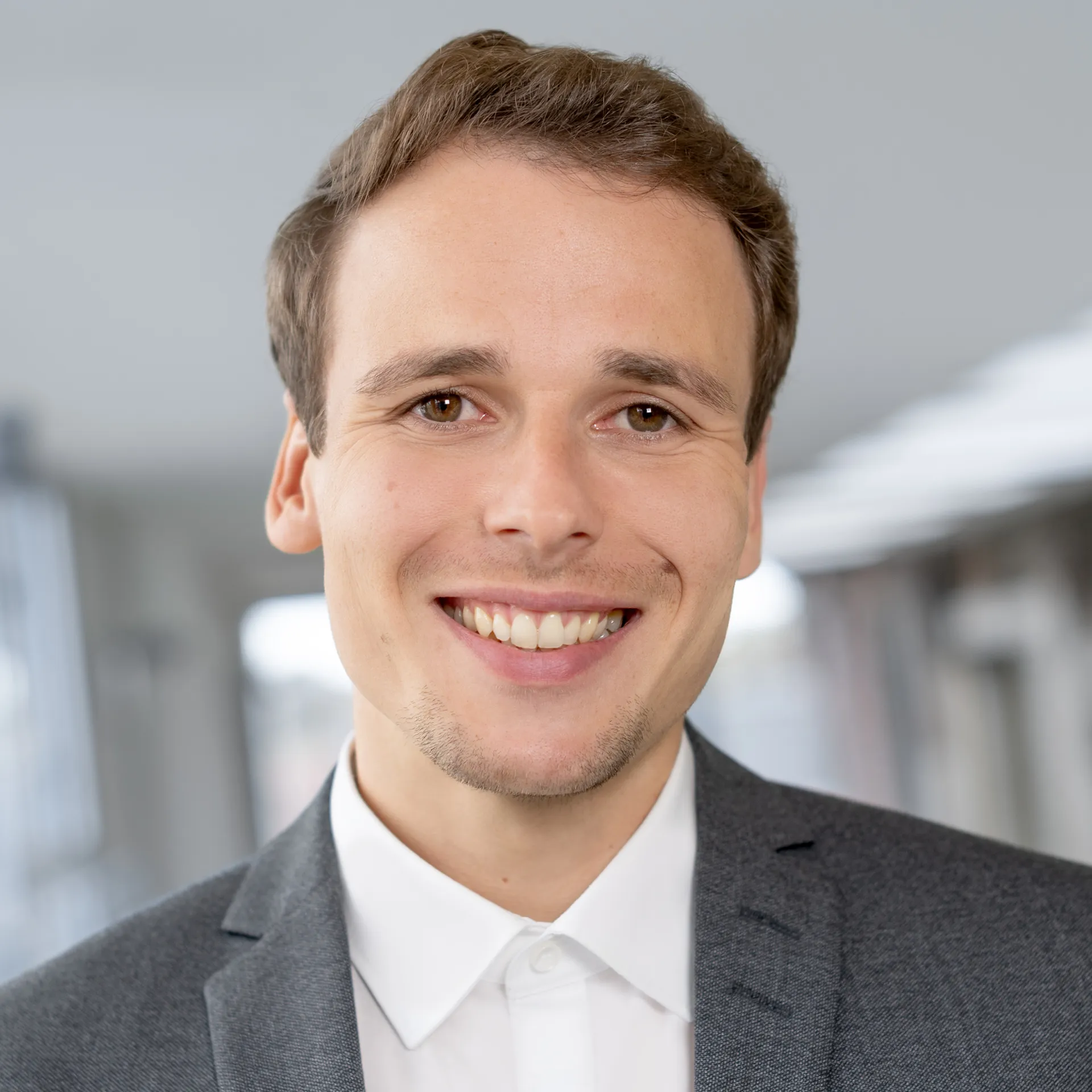 a man smiling at the camera