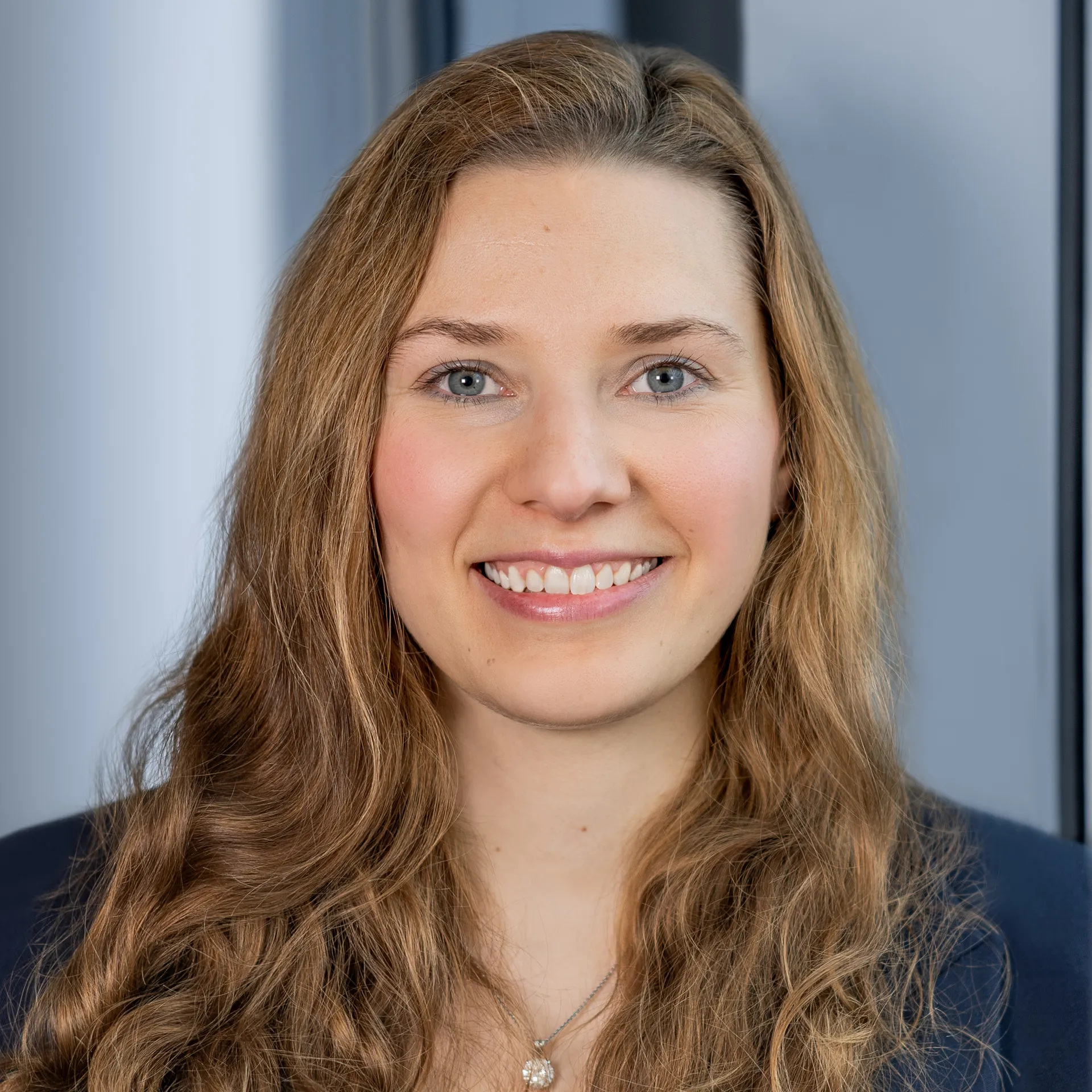 a woman with long hair smiling