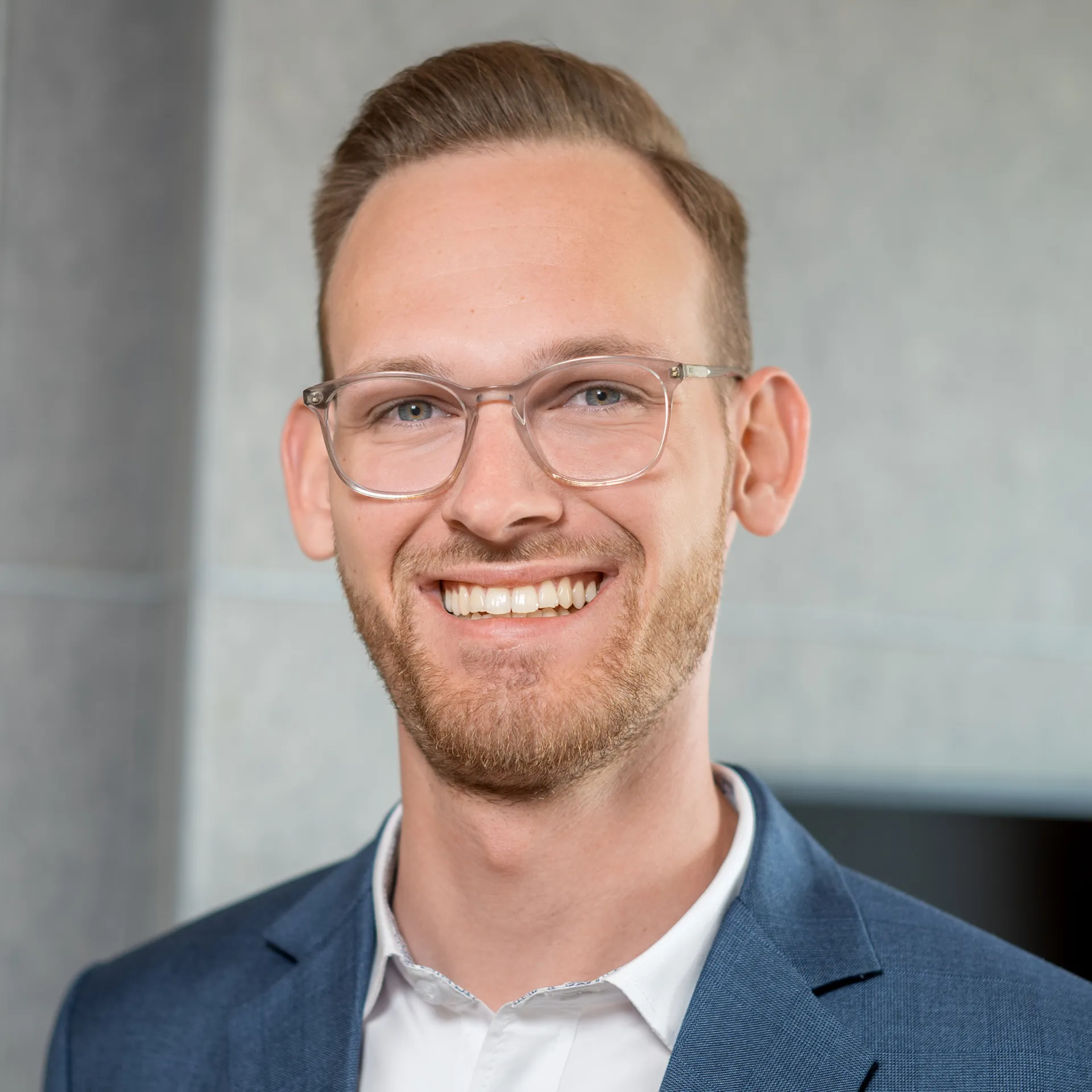 a man smiling at the camera