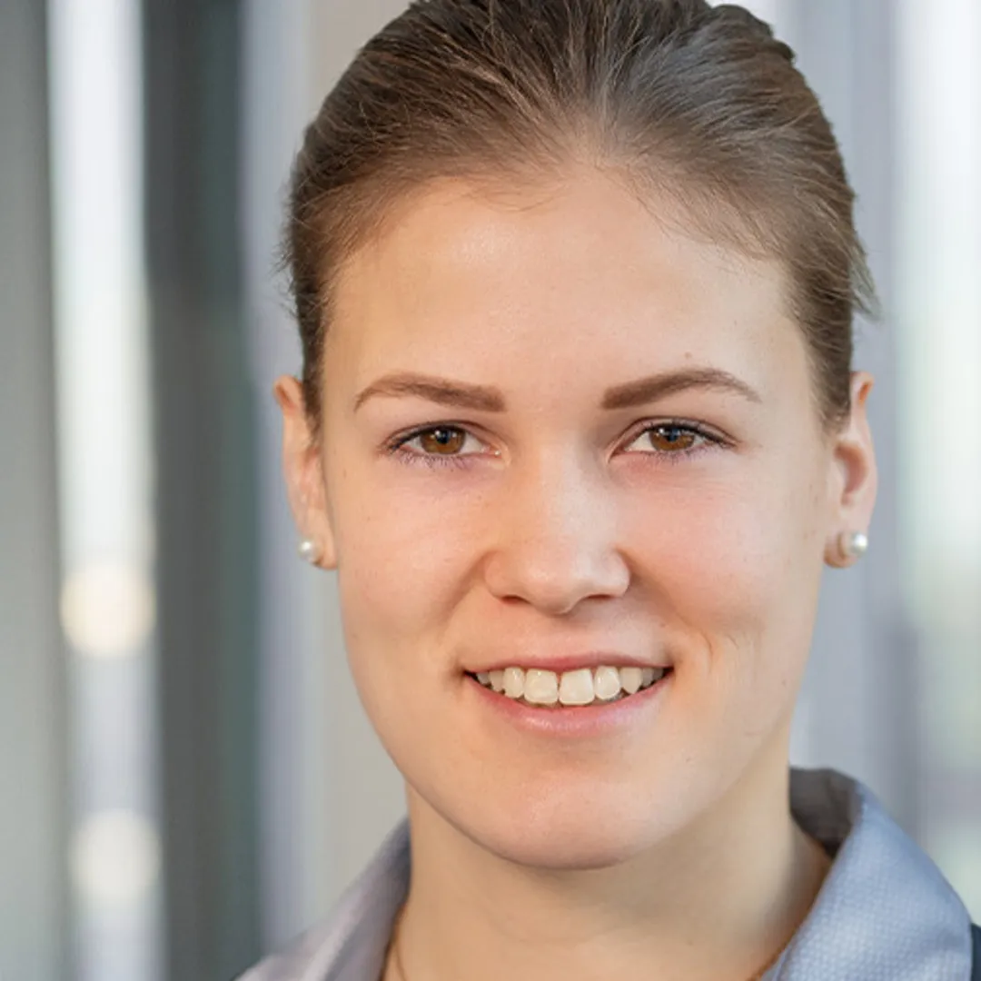 a woman smiling at the camera