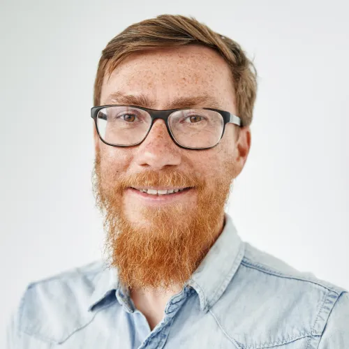 a man with red beard and glasses a man with red beard and glasses