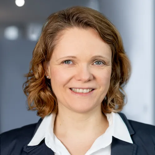 a woman smiling at camera a woman smiling at camera