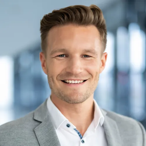 a man smiling at the camera