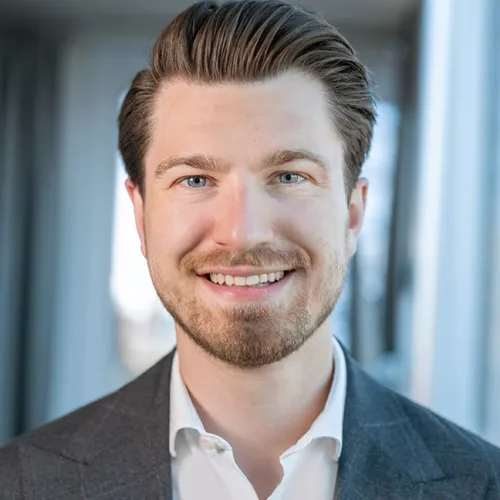 a man smiling at the camera a man smiling at the camera