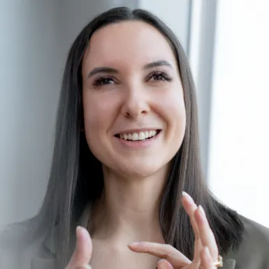 a woman with long hair smiling