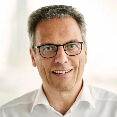 a man wearing glasses and a white shirt a man wearing glasses and a white shirt